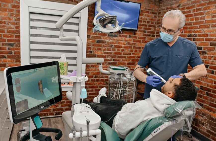 Dentist performing a digital smile scan during a cosmetic smile makeover consultation at A Plus Dentistry.