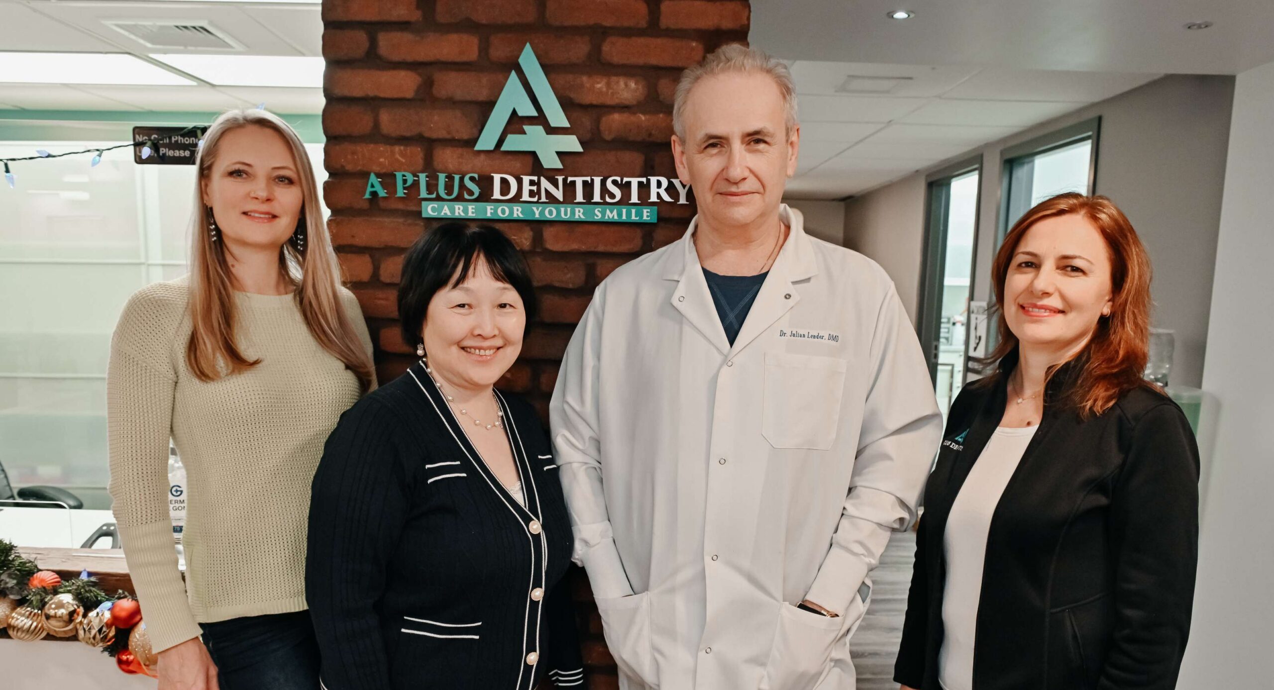 A Plus Dentistry dental team welcoming new patients to their dental office in Brookline, MA.
